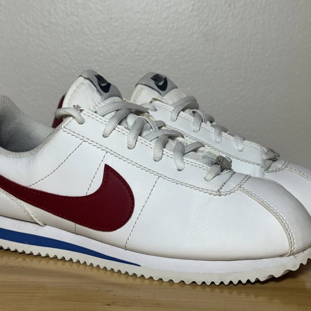 Nike Men's White Sneakers with Red Swoosh and Blue Accent